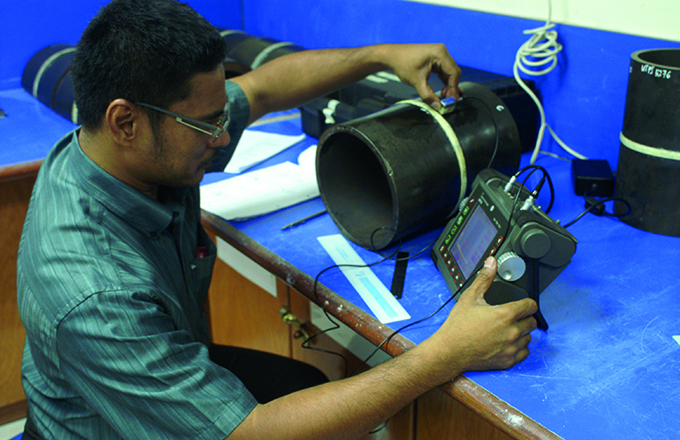 Student inspecting a circumferential weld using ul